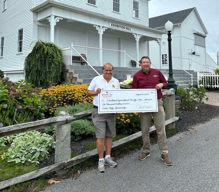 Pictured are General Manager of The Woodstock Fair receiving a donation from Jewett City Savings Bank President & CEO.